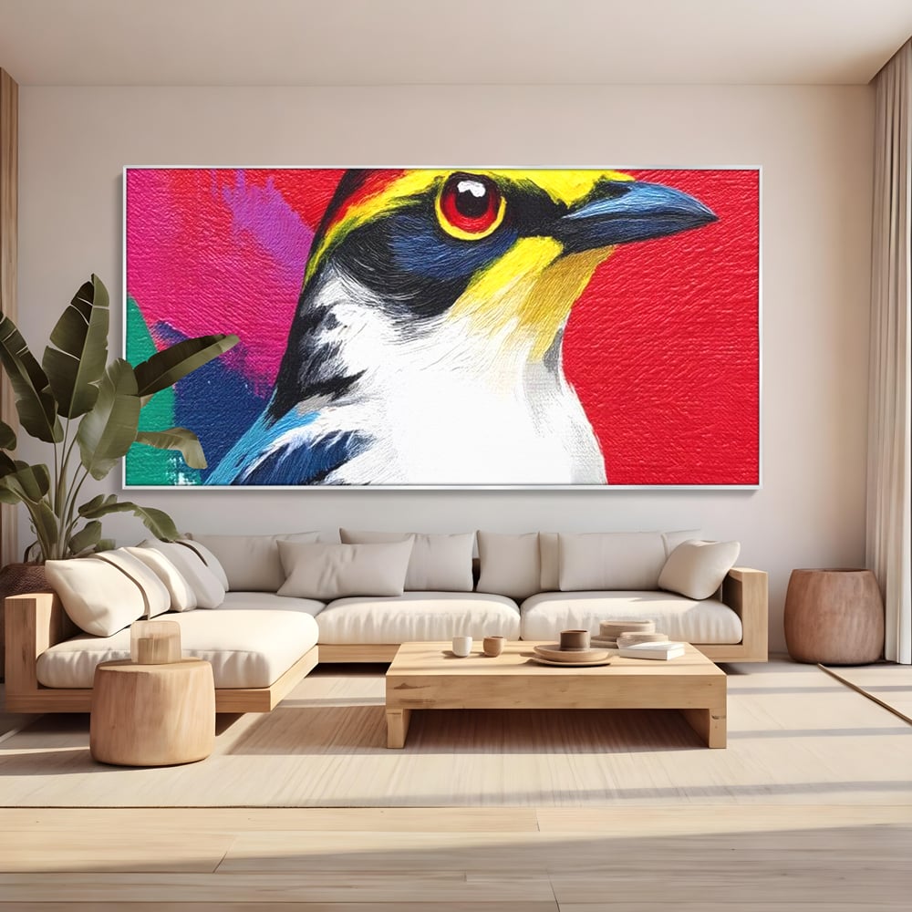Tablou canvas cu tablou canvas cu pasare colorata in profil, in rama de aluminiu argintiu, pe perete intr-un living